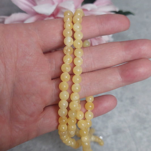 Helmiä 6mm, Appelsiinikalsiitti 38cm nauha