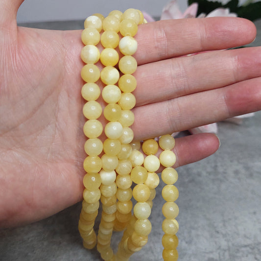 Helmiä 8mm, appelsiini kalsiitti 38cm nauha